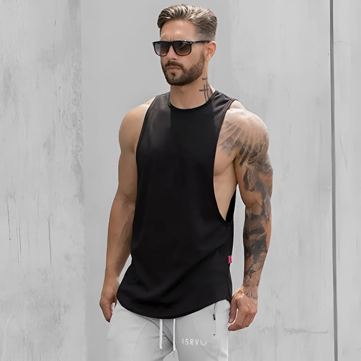 Men's sleeveless long tank muscle workout t-shirt in black, gray, green, khaki, or white, sizes M to XXL.