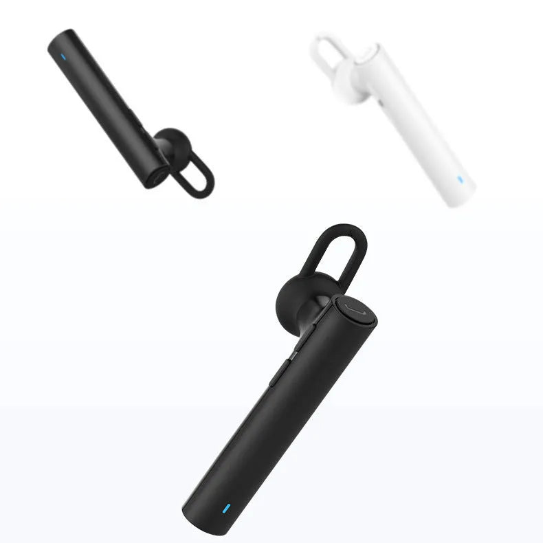 Compact black and white wireless Bluetooth headset showing size scale.