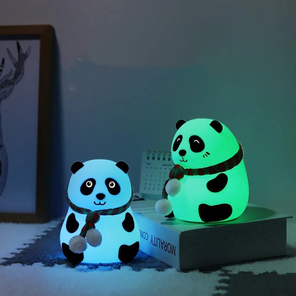 Panda-shaped silicone and ABS night light with soft glow, shown with USB charging cable.