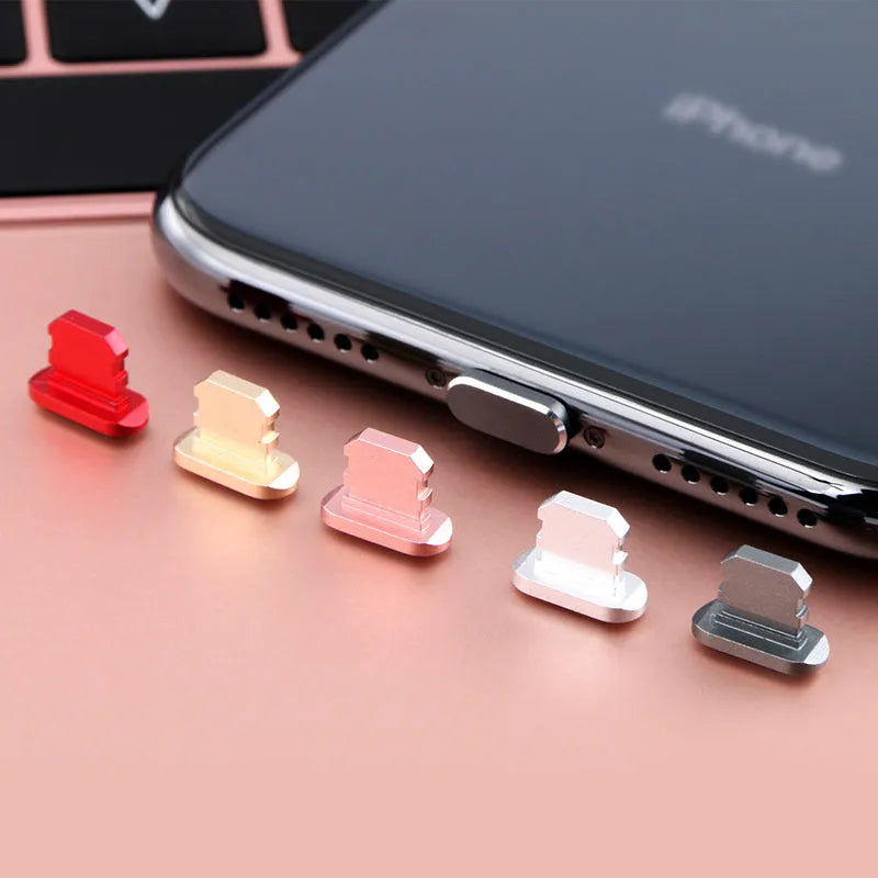 Aluminium alloy dust plug for iPhone charging port in various metallic colours.