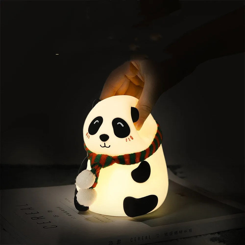 Panda-shaped silicone and ABS night light with soft glow, shown with USB charging cable.
