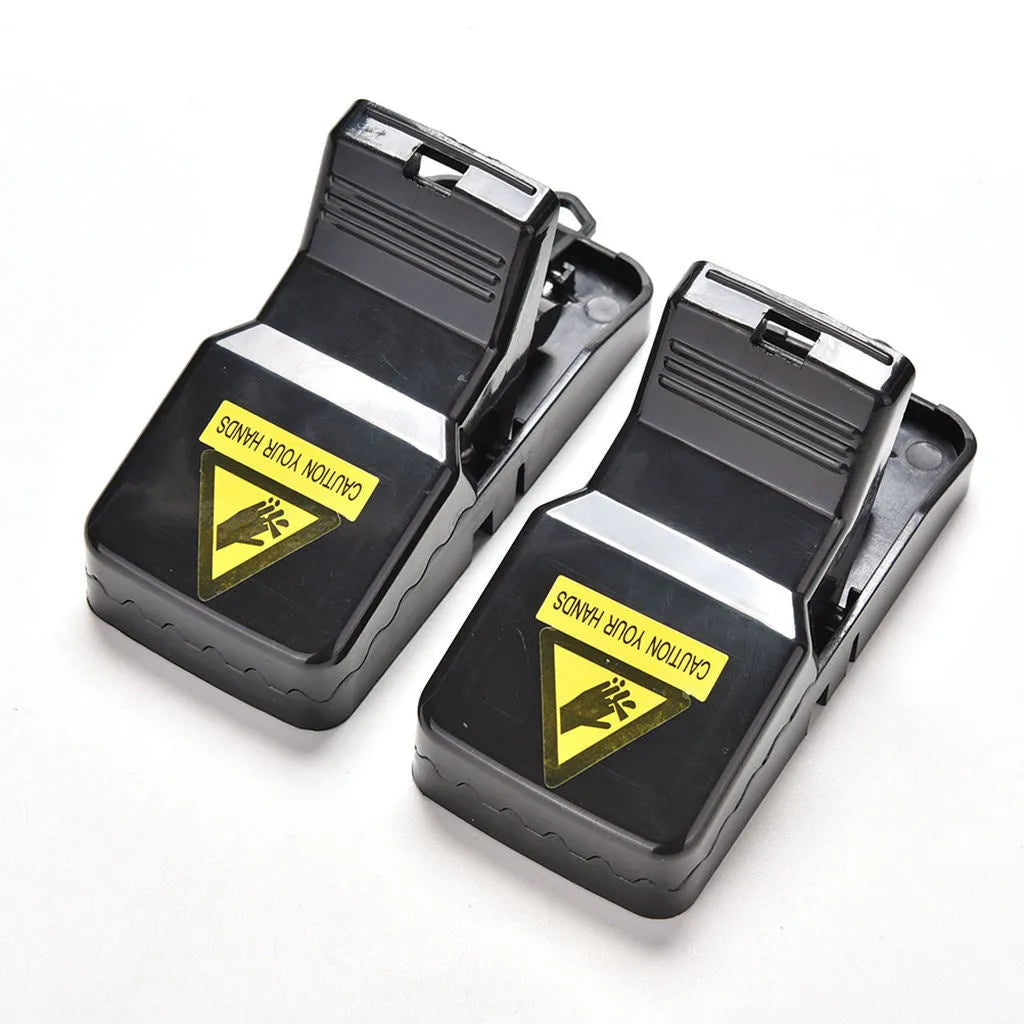 Six black plastic snap mousetraps showing dimensions and smooth surface.