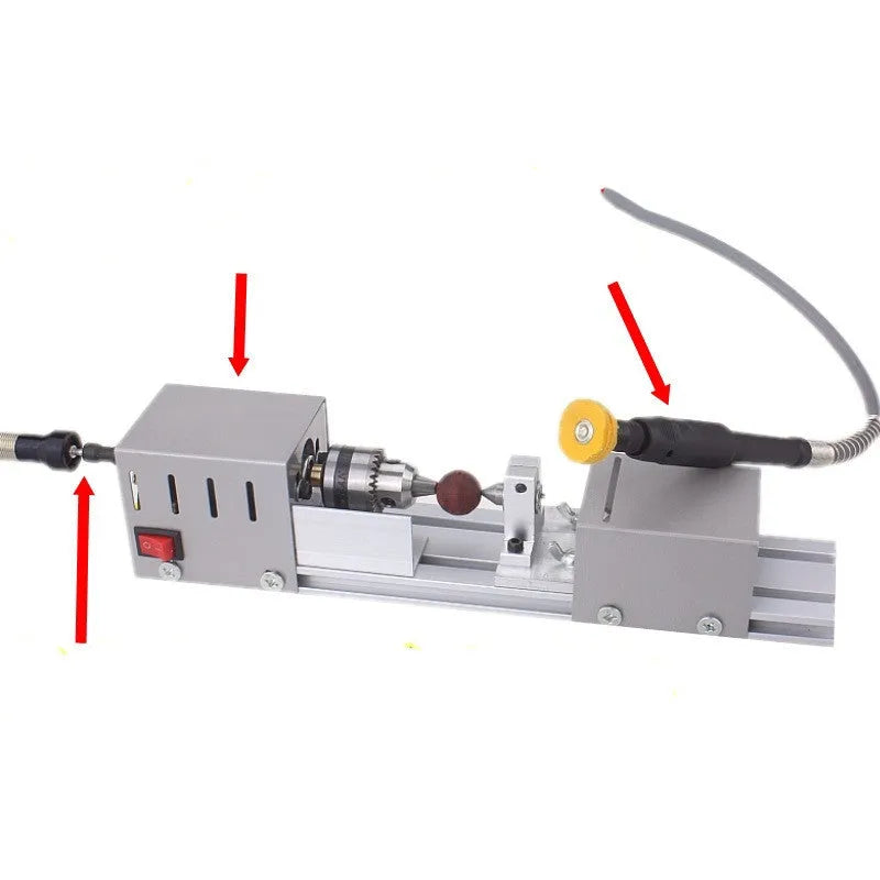 Compact silver metal mini woodworking lathe with tools for manual wood turning, showing scale.