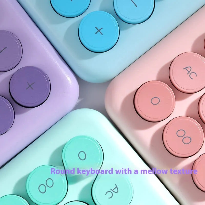 Desktop calculator with gradient colour finish in violet, pink, blue, or mint green on a desk