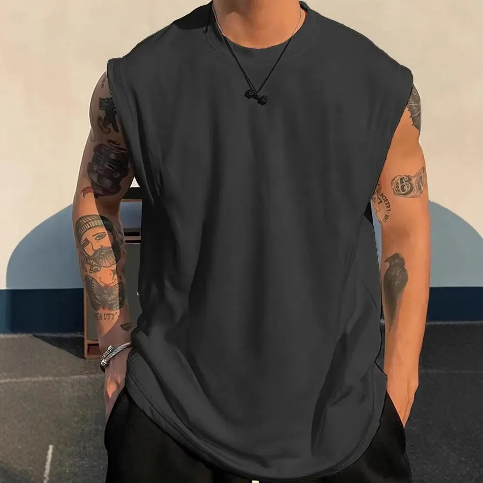 Men's loose cotton tank top in solid colours showing straight hem design and sleeveless cut