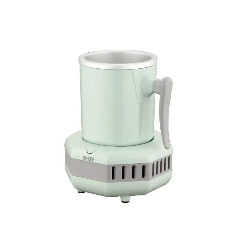 White mini quick cooling cup with aluminium drinking vessel and electronic base on a desk.