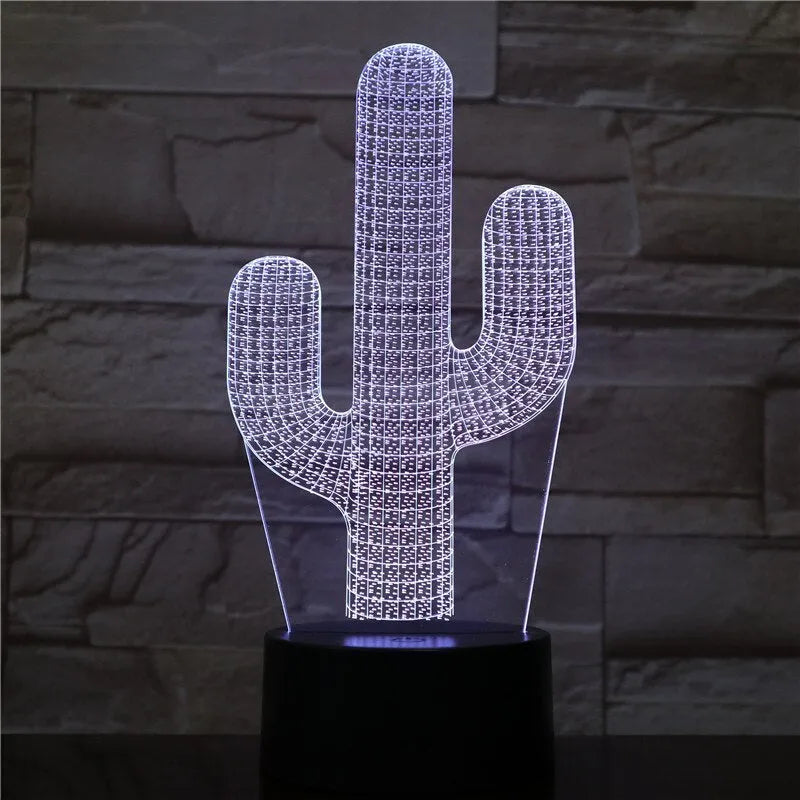 Cactus LED night light with 3D illusion board showing green glow on a table