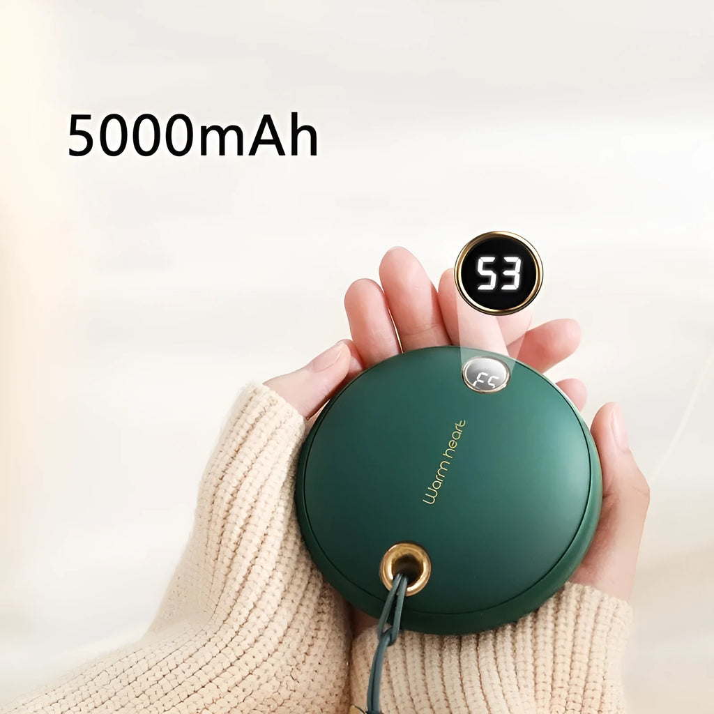 Green portable hand warmer power bank with digital display showing 5000mAh capacity