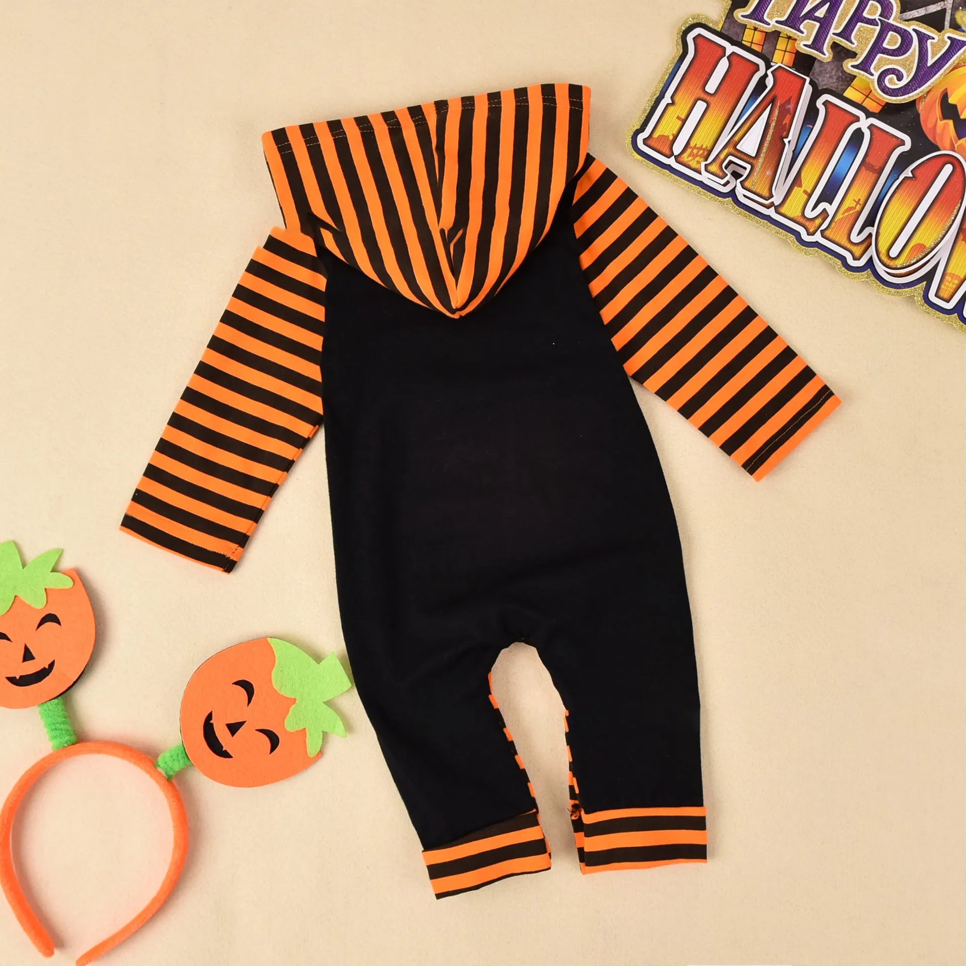 Black or brown cotton Halloween romper for children with long sleeves and a hood.