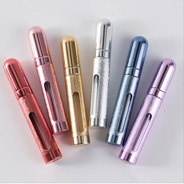 Slim 12ml aluminium travel perfume bottle with glass liner in blue, gold, pink, red, silver, and violet colours.