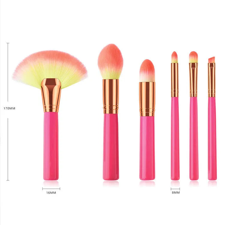 Pink wooden handle synthetic bristle makeup brush set in a compact case
