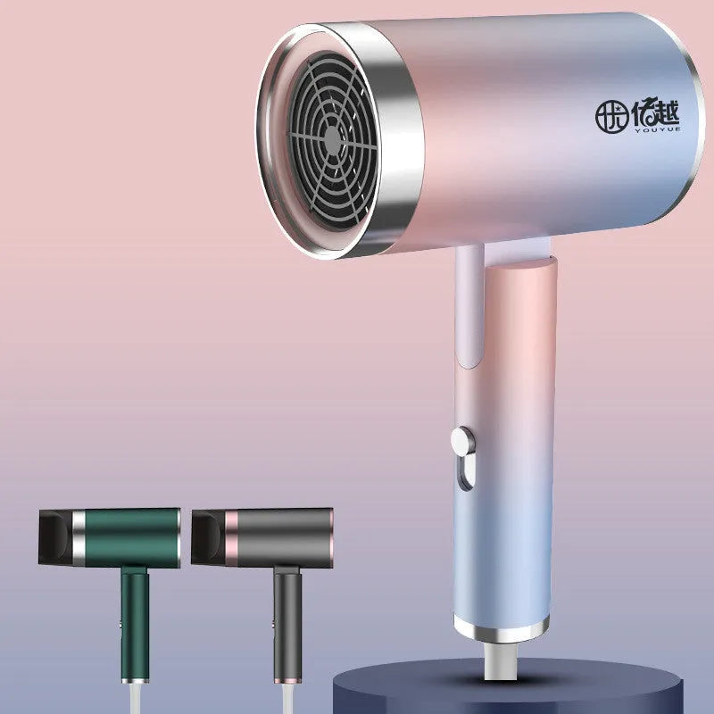 Foldable negative ion hair dryer in emerald green colour with collapsed handle showing compact design