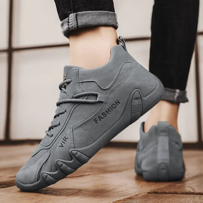 Men's grey low-cut slip-on work shoes with non-slip sole and elastic band.