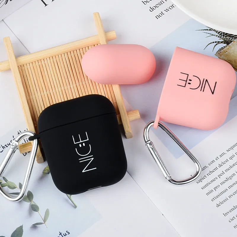Black and Pink AirPods case covers with Flower, Love, and Smiley face emoji designs.