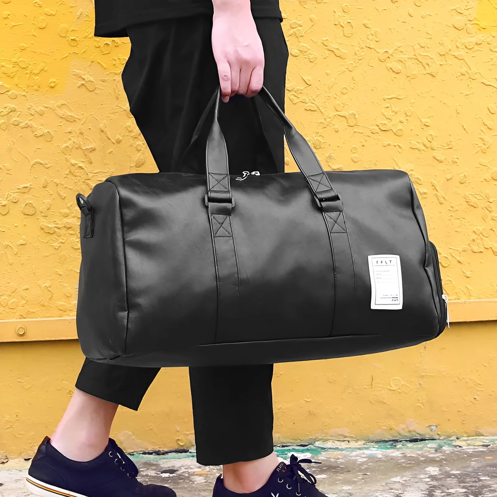 Black waterproof sports bag with separate side shoe compartments and diagonal shoulder straps