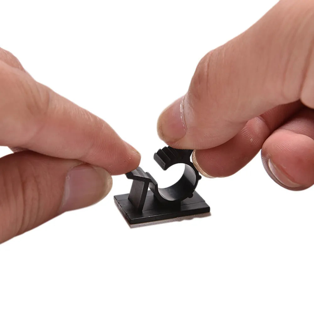 Black nylon adhesive cable clamps in a pack of 10 for securing wires up to 13mm thick.