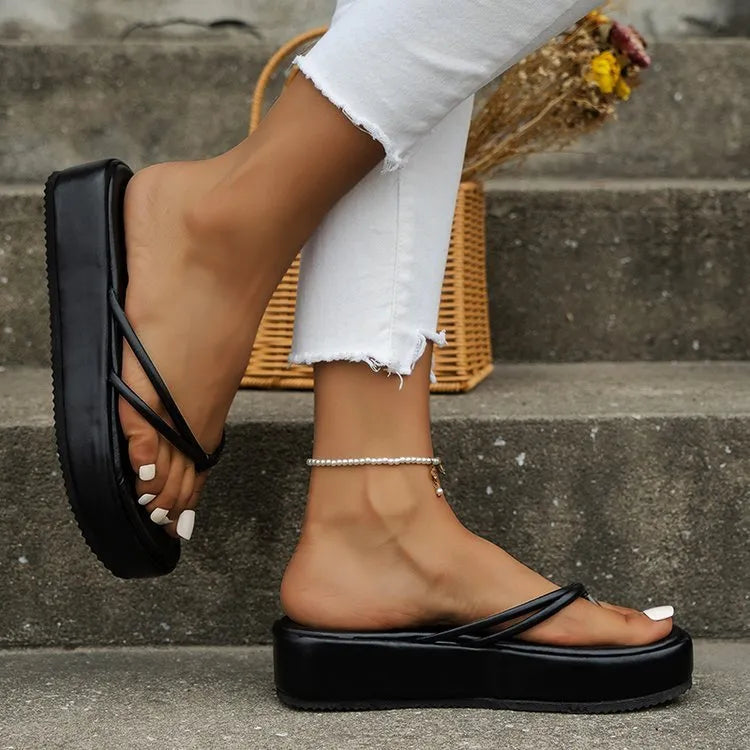 Casual thick-soled flip-flops in various colours on a white background.