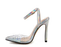 Gold glitter pointed toe stiletto sandals for women on a white background