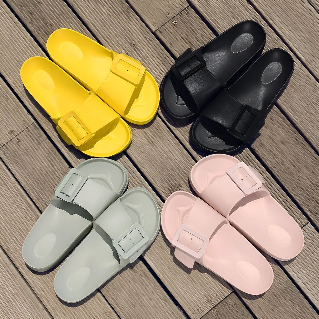Grey blue women's flip-flop slippers with a single buckle on a soft EVA sole.