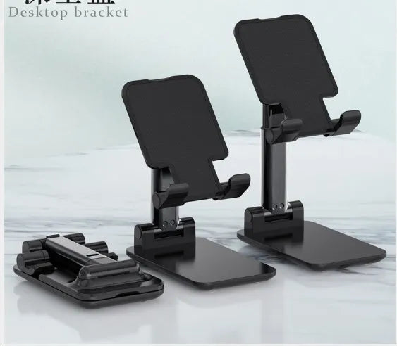 Black desk mobile phone holder made of silicone and ABS plastic on a wooden desk