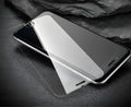 0.26mm thick tempered glass screen protector with 9H hardness for smartphones on a white background.