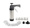 Stainless steel biscuit press machine with assortment of cookie moulds and piping nozzles on a kitchen worktop