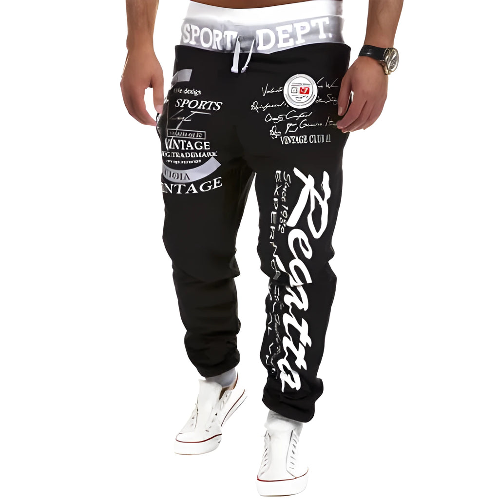 Drawstring loose track pants in black and white with elasticated waistband and adjustable drawstring, available in multiple sizes.