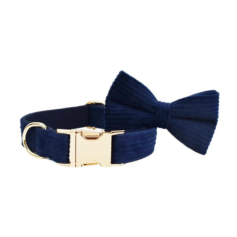 Navy blue corduroy dog collar and leash set with matching bow, vest, and poop bag