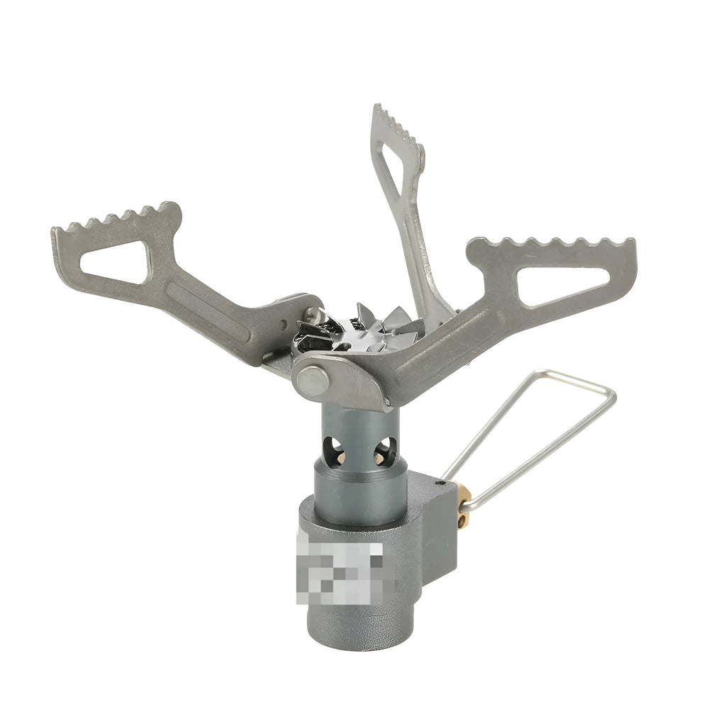 Portable one-piece propane gas camping stove on a outdoor surface.