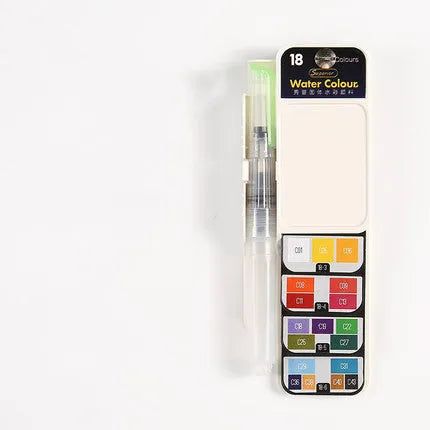 Open fan-shaped foldable solid watercolour paint set showing colours, fountain pen, palette, and sponge in transparent box.