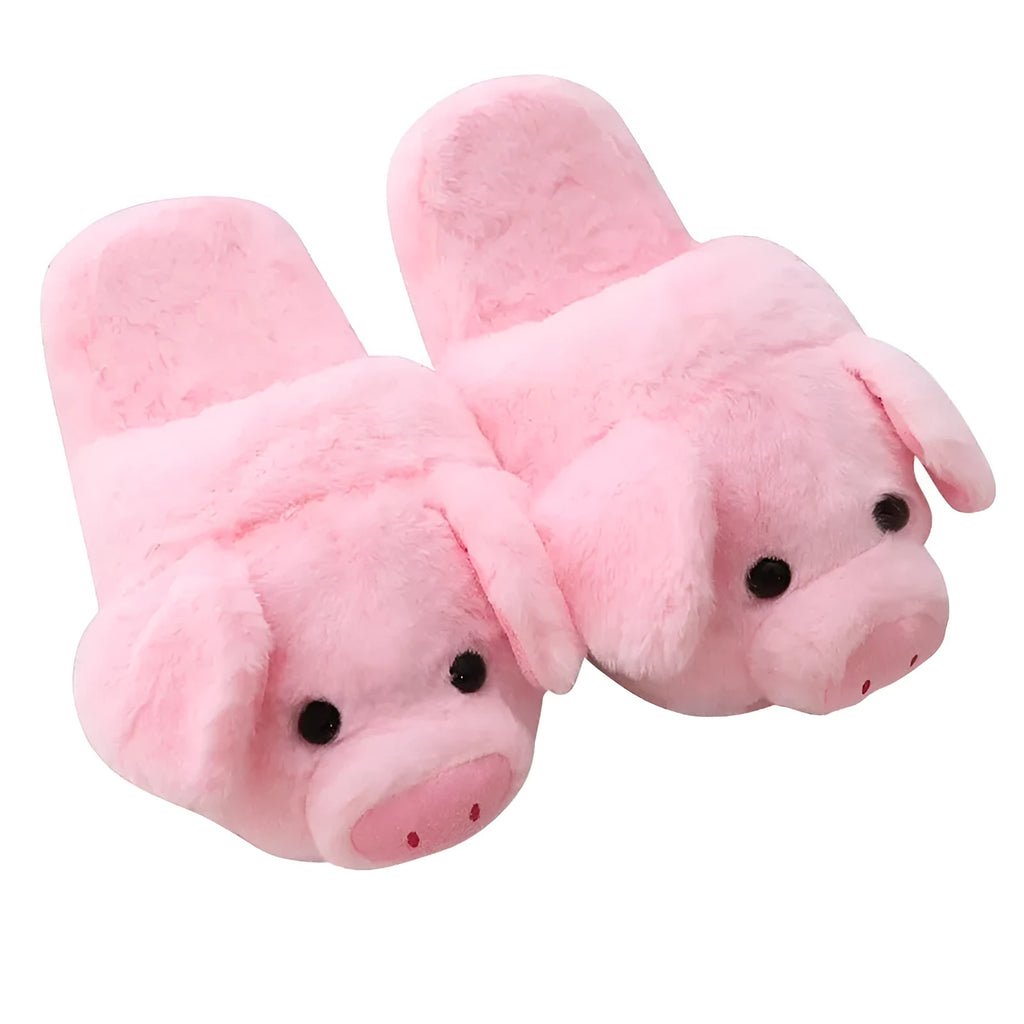 Pink pig-shaped plush indoor slippers with a cute animal face design, shown on a plain background.