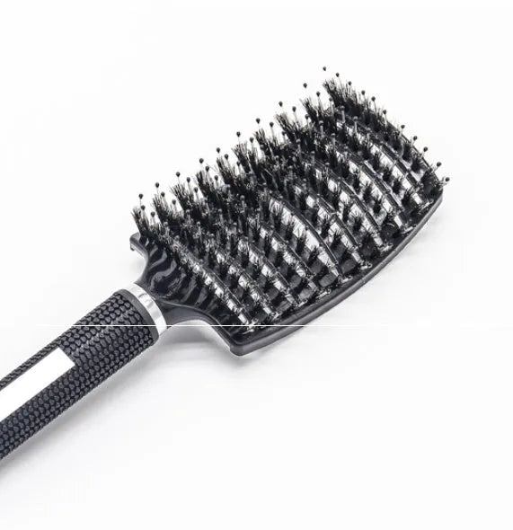 Black bristle and nylon hairbrush with arched comb head and non-slip rubber handle on white background
