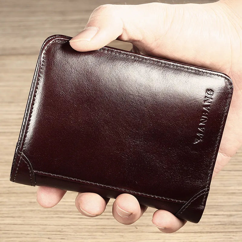 Men's black leather wallet open to show internal card slots, coin pocket, and banknote compartment.