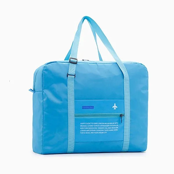 Large capacity foldable nylon travel bag in blue, showing open storage and compact folded size on suitcase