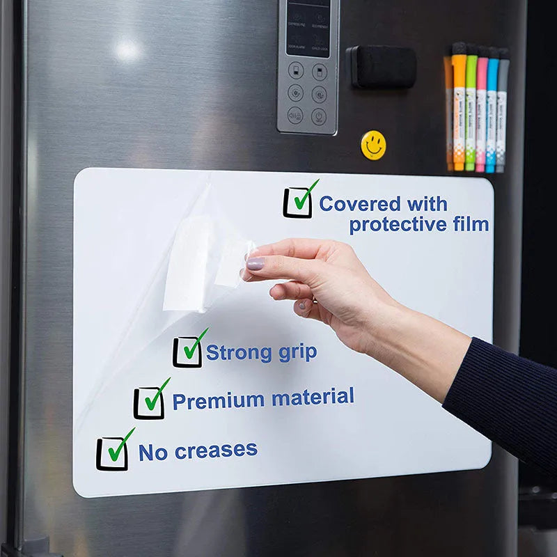 A3 magnetic whiteboard with rounded corners on refrigerator surface showing handwritten notes