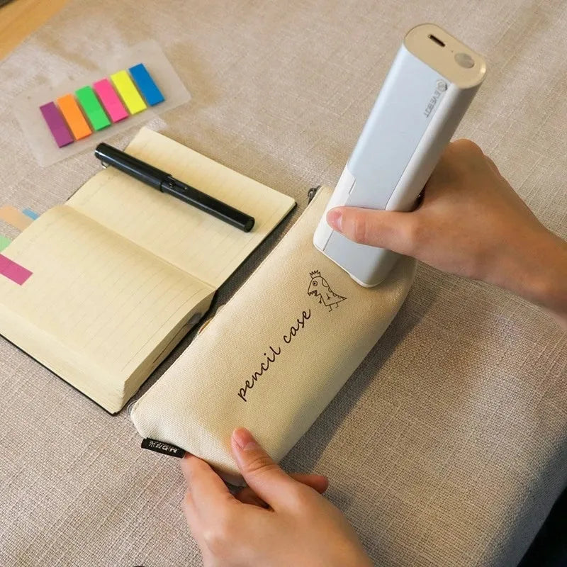 White handheld portable printer with 300dpi accuracy, 26mm print width, Type-C port, and navy blue ink cartridge