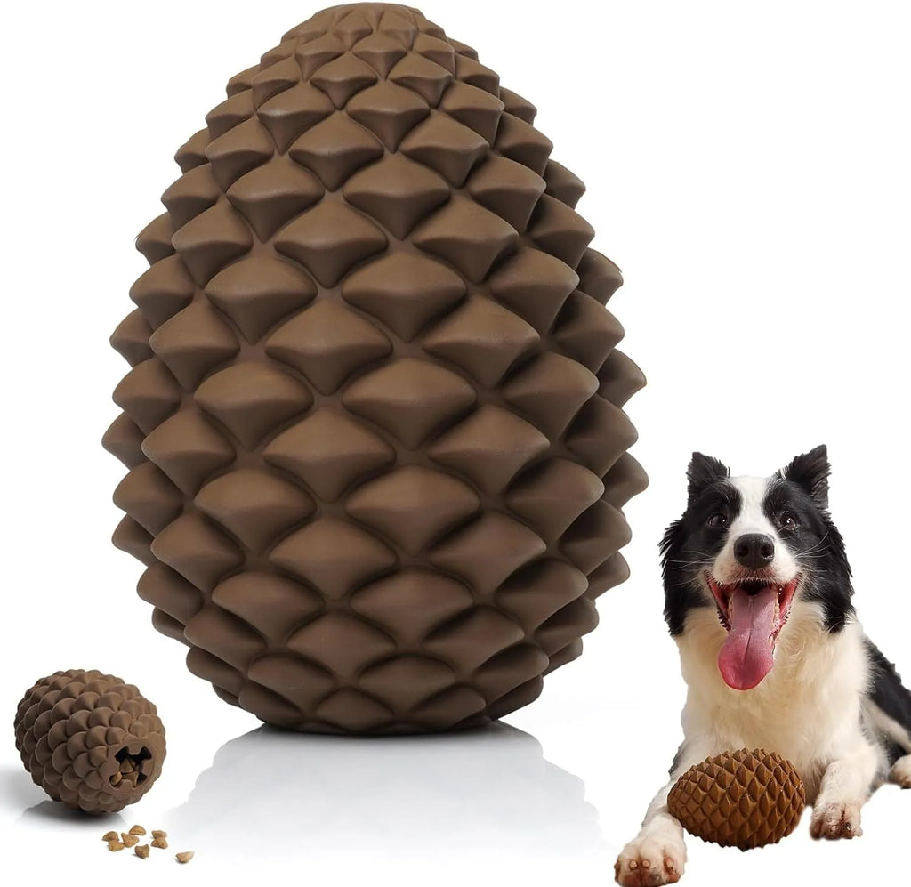Yellow pine cone-shaped natural rubber dog toy with textured surface and treat dispenser hole.