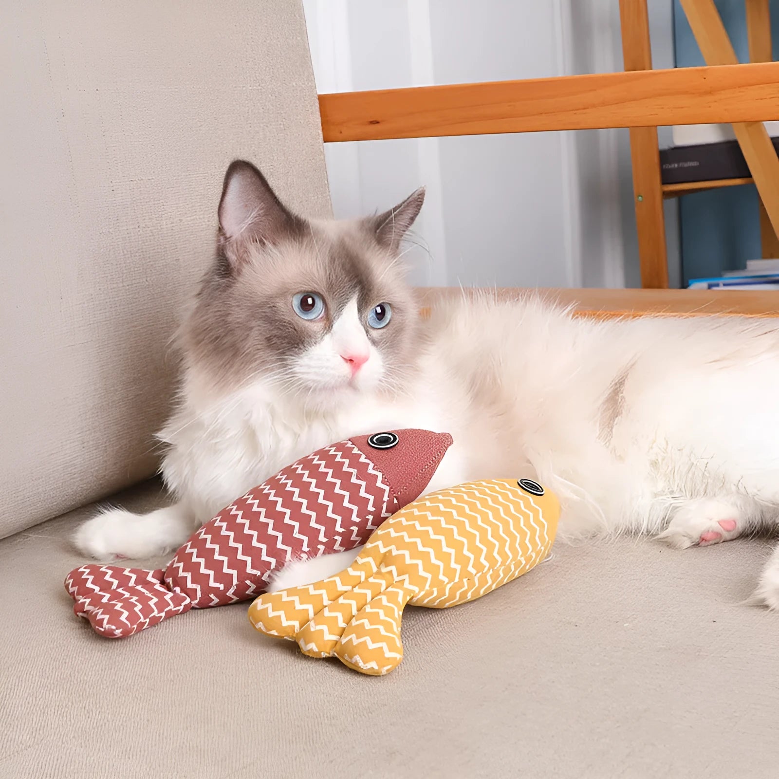 Set of three linen fish cat biting toys in navy blue, red, and yellow. Each measures 21x9x5cm.