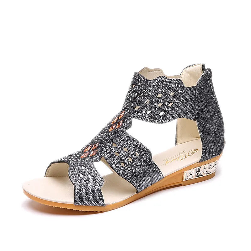 Women's beige open toe sandals with rhinestone detail and a back zipper.