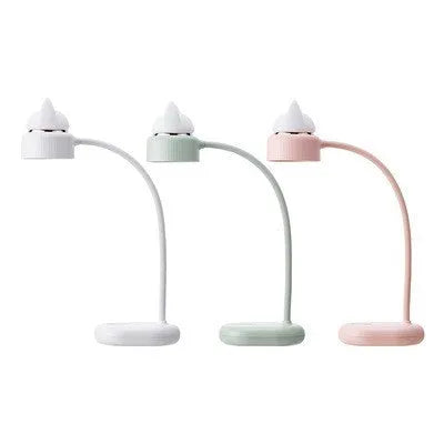 White clip-on LED desk lamp attached to a shelf, showing its USB cable and modern design.