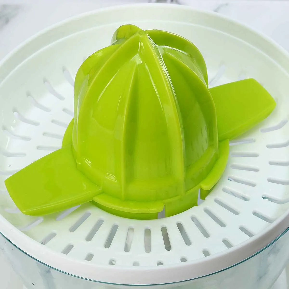 40W household orange juicer with plastic body, crescent feed mouth, and pulp box on a kitchen counter