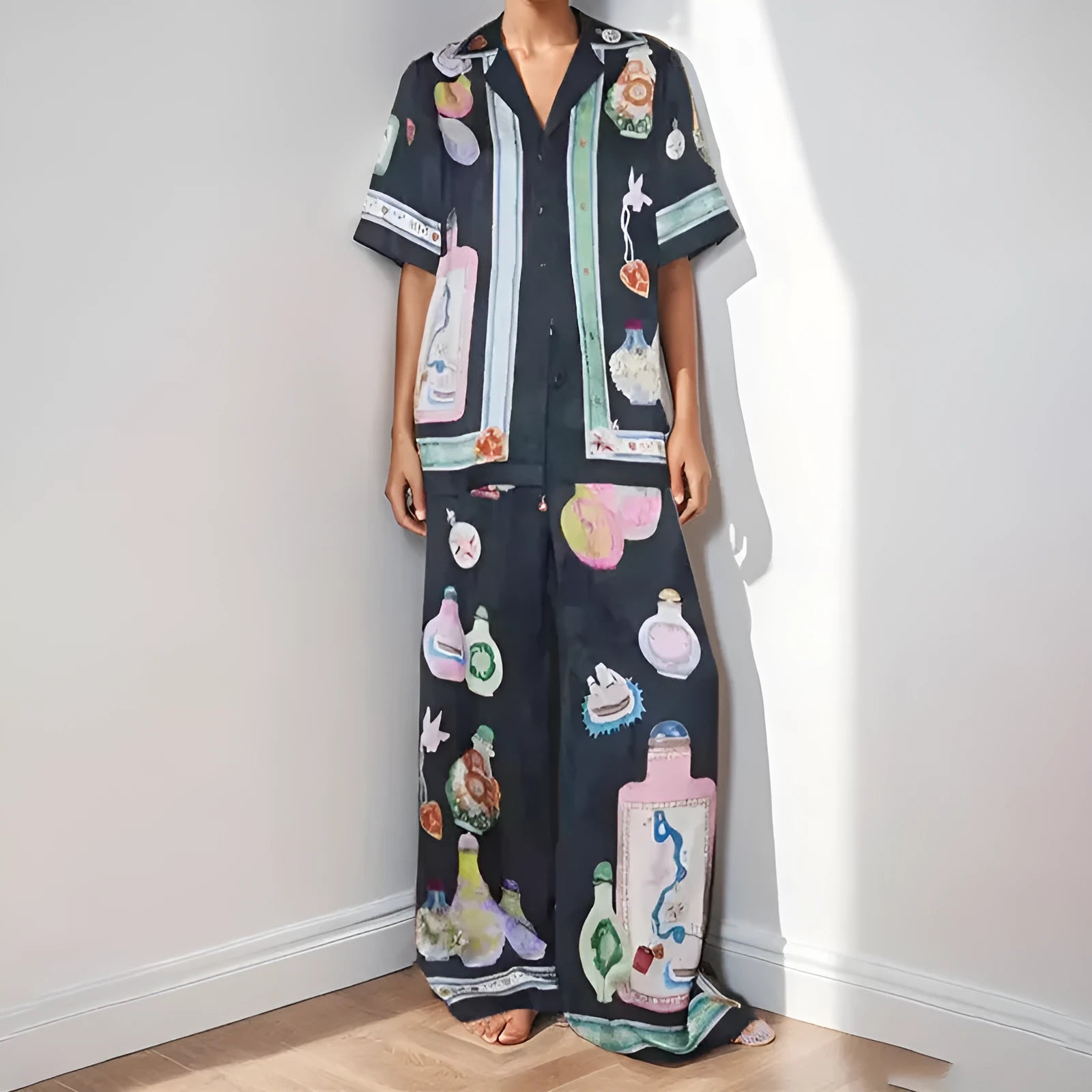 Black women's casual set with cartoon pattern cardigan and matching trousers