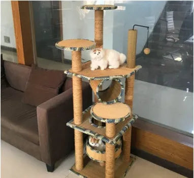 Cat playing on a natural wheat straw scratch board climbing frame with multiple levels