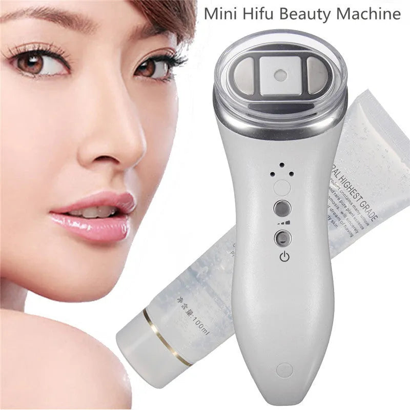 Mini ultrasonic scalpel for home facial firming in purple, with power adapter and gel on white background