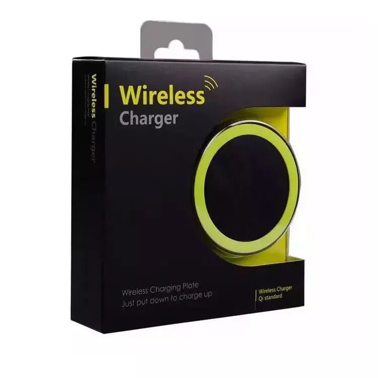Qi wireless charging base for mobile phones in six colours on a wooden table.