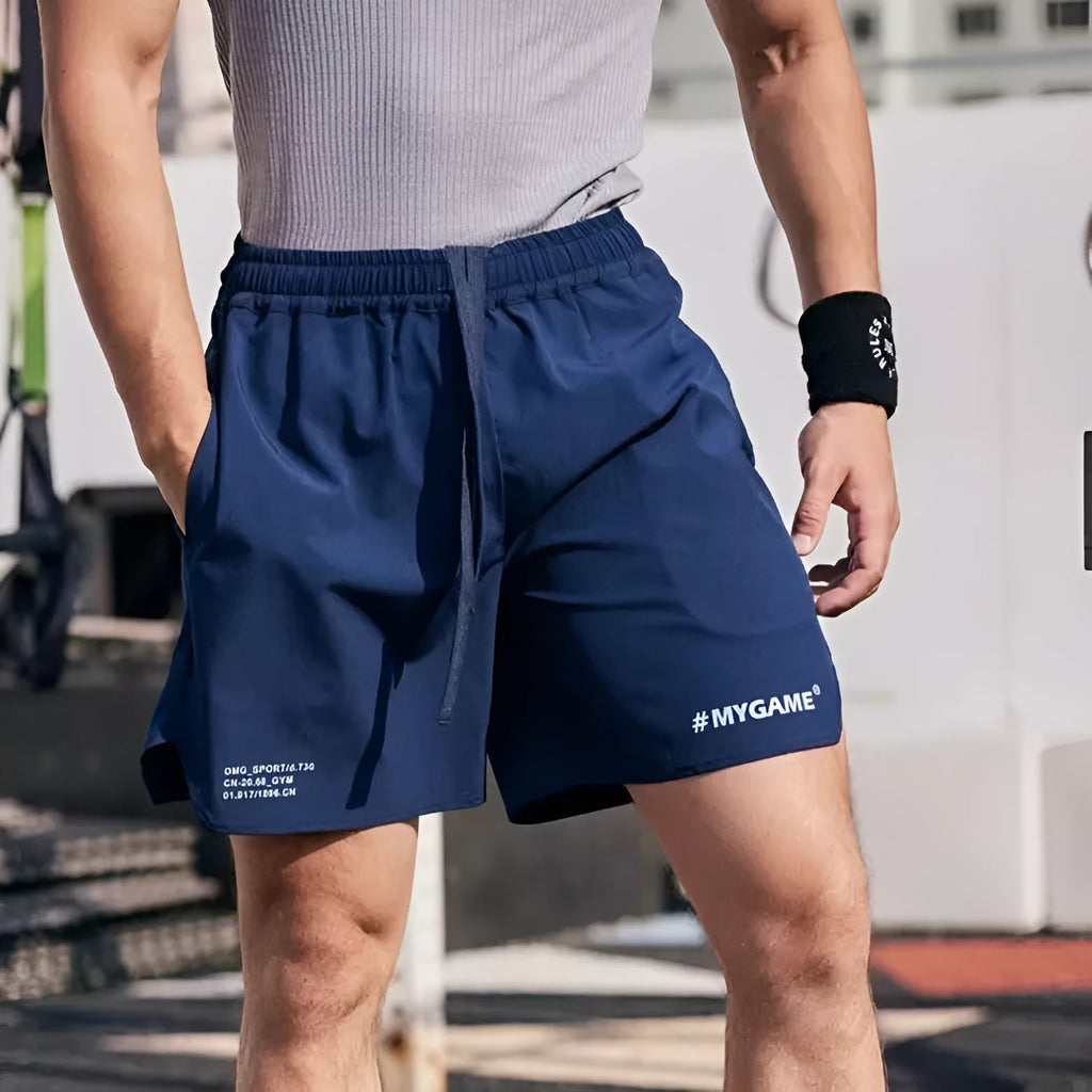 Men's grey quick-dry fitness shorts with a short-length cut for training.
