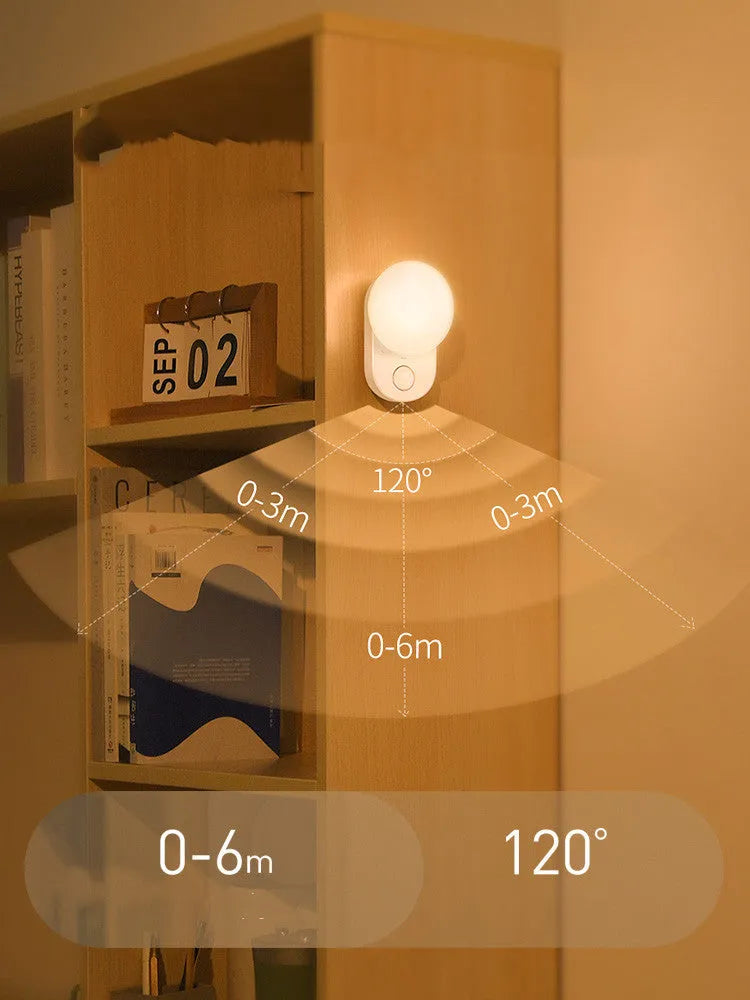 White Baseus Sunshine Series rechargeable LED night light with motion sensor on a bedside table.
