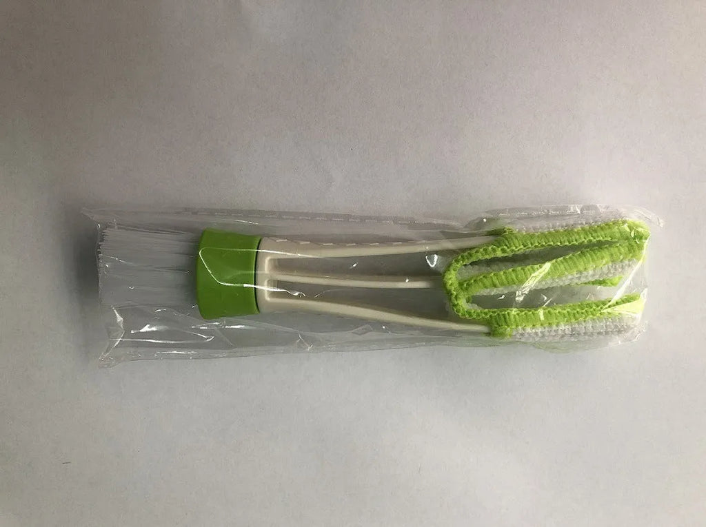 Green car dust removal brush with soft bristles and removable microfibre cloth cover for dashboard and air vent cleaning