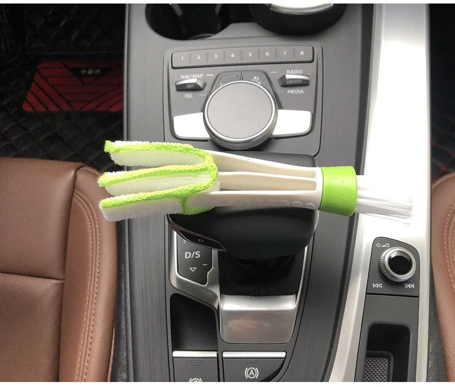 Green car dust removal brush with soft bristles and removable microfibre cloth cover for dashboard and air vent cleaning