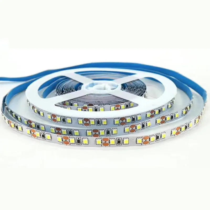 Flexible white LED light strip on a spool, labelled for 12V operation, suitable for shelf and counter lighting.
